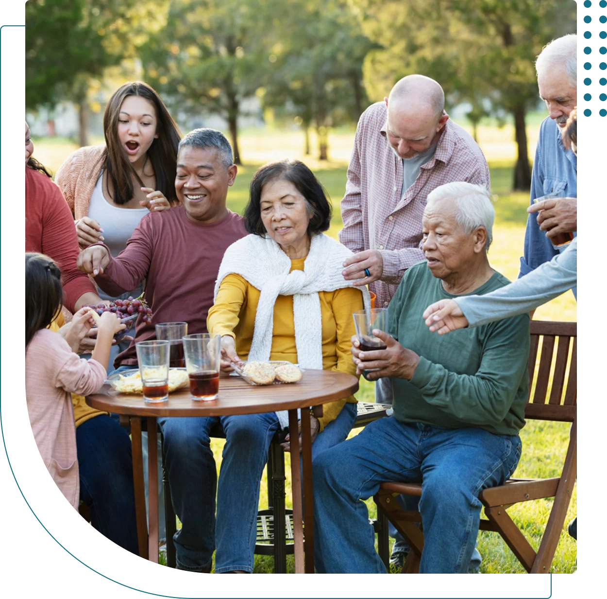 Family enjoying a picnic outdoors together.